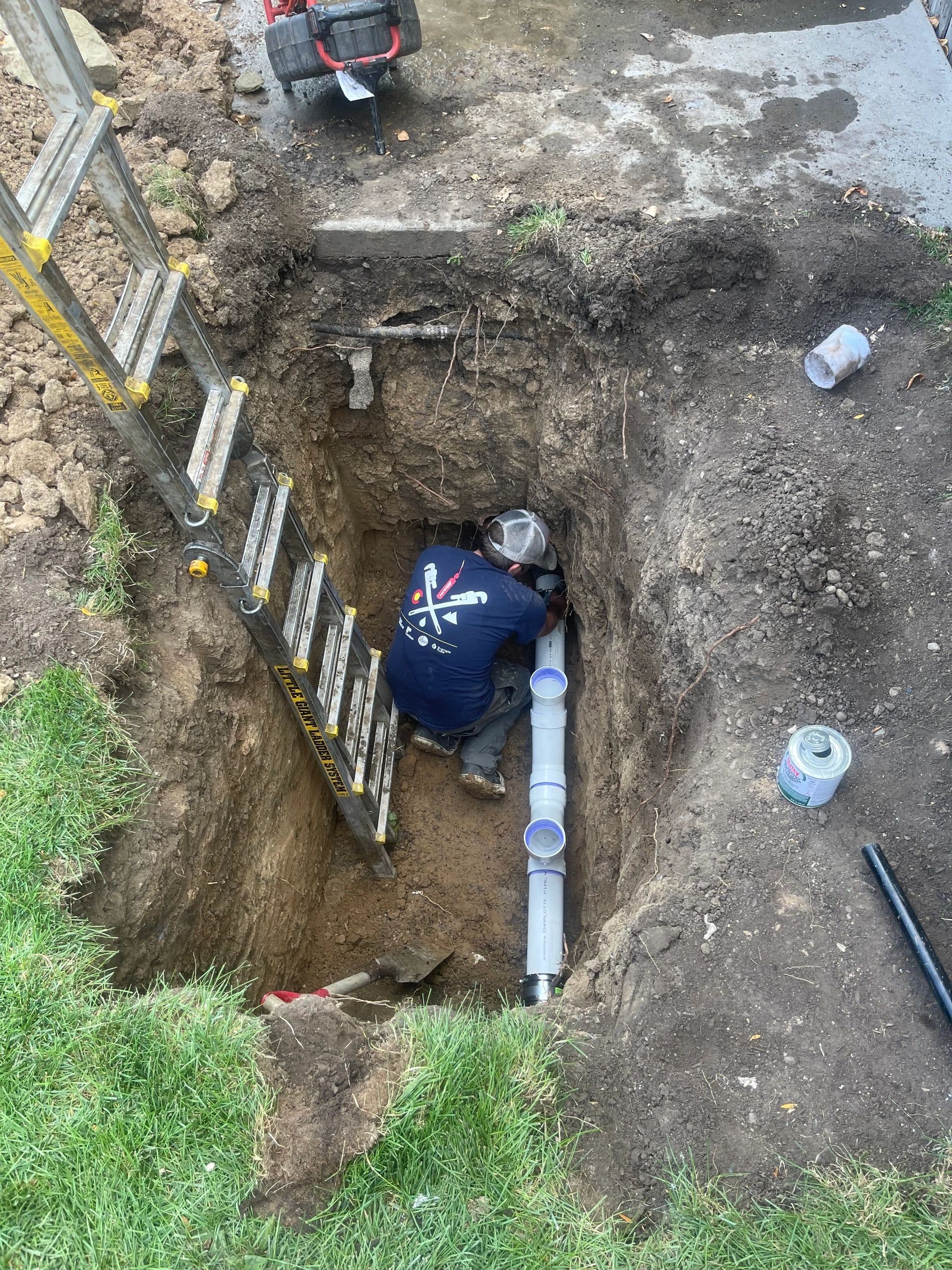 Team member working on sewer line repair