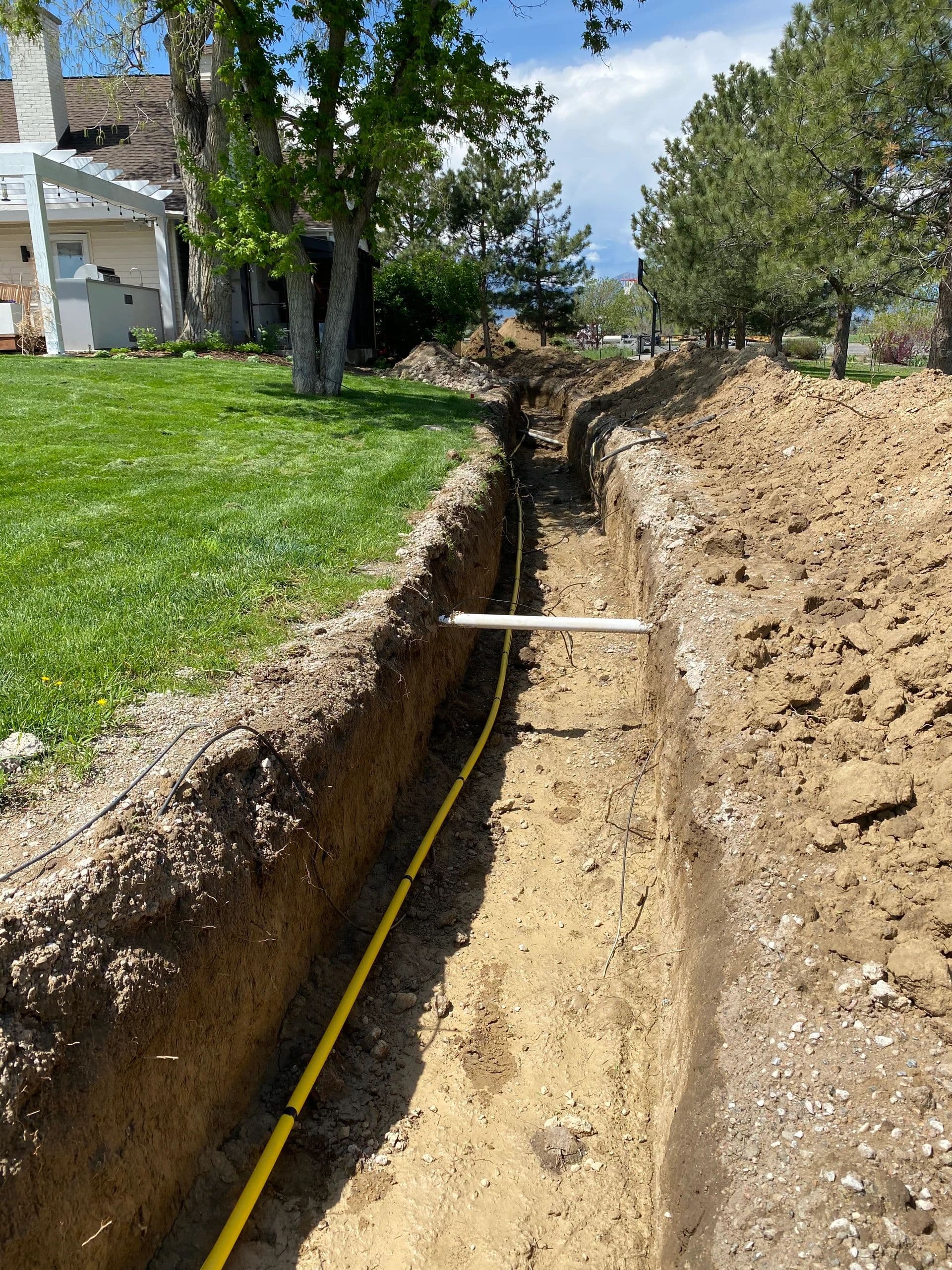 Sewer and gas line trench at a residential property